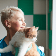 Female vet nurse with cat